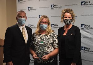 MHA CEO Brian Peters; Beth Bedra, RN, patient safety officer, ProMedica Monroe Regional Hospital, and Sarah Scranton, MPA, vice president, safety and quality, MHA and MHA Keystone executive director.